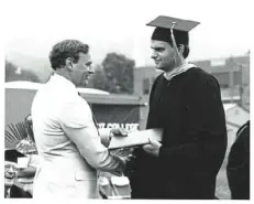  ?? Courtesy of John Fetterman ?? Karl Fetterman, left, shakes hands with his son John Fetterman as John receives his diploma from his father’s alma mater, Albright College, in May 1991.