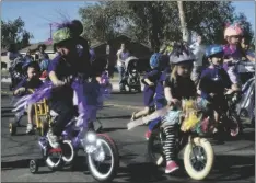  ?? PHOTO ELIZABETH MAYORAL CORPUS ?? Participan­ts in Thursday’s parade for military children at NAF El Centro included a number of youngsters on bicycles.