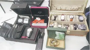  ??  ?? Luxury watches and pens among items seized at the secretary-general’s house at USJ, Subang Jaya. — Bernama photo