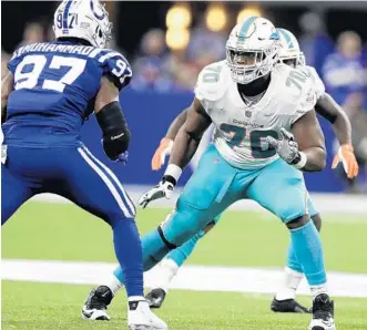  ?? DARRON CUMMINGS/AP ?? According to ProFootbal­lFocus.com, Dolphins tackle Ja'Wuan James has allowed just five sacks this season.