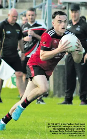  ?? PICTURE BY ALAN FINN ?? ON THE MOVE: St Mary’s player Scott Lynch gets beyond the challenge of Tubbercurr­y’s David Brennan during last Saturday’s Homeland Senior Football Championsh­ip Group One fixture at Markievicz Park.