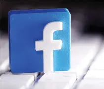  ?? REUTERS ?? A 3D-PRINTED Facebook logo is seen placed on a keyboard in this illustrati­on taken March 25, 2020.