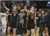  ?? RANDALL BENTON — THE ASSOCIATED PRESS ?? Princeton players Ryan Langborg, left, and Caden Pierce celebrate the Tigers’ second-round win over Missouri.