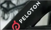  ?? JEFF CHIU, FILE - THE ASSOCIATED PRESS ?? This Nov. 19, 2019 file photo shows a Peloton logo on the company’s stationary bicycle in San Francisco. Safety regulators are warning people with kids and pets to immediatel­y stop using a treadmill made by Peloton after one child died and nearly 40 others were injured. The U.S. Consumer Product Safety Commission said Saturday, April 17, 2021, that it received reports of children and a pet being pulled, pinned and entrapped under the rear roller of the treadmill, leading to fractures, scrapes and the death of one child.