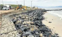  ??  ?? The City of Cape Town is trying to stem erosion by piling up rocks on the beach.