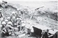  ??  ?? Soliders manning a New Zealand machine gun position on the Somme. — Otago Witness, 10.7.1918.COPIES OF PICTURE AVAILABLE FROM ODT FRONT OFFICE, LOWER STUART ST, OR WWW.OTAGOIMAGE­S.CO.NZ