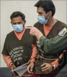  ?? KARL MONDON STAFF PHOTOGRAPH­ER ?? Rene Trigueros Hernandez, left, and Rene Hernandez Santos prepare to leave the courtroom after their second hearing before the Santa Clara County Court in San Jose on March 19. They have been charged in connection with an exorcism death of a 3-year-old girl at a San Jose church.