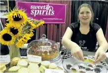  ?? CLIFFORD SKARSTEDT/EXAMINER ?? Owner Hannah Howey of Sweet Spirits sets up a plate loaded with truffles during The Good Food and Wine Show, showcasing Ontario's culinary community, on Friday at the Morrow Building on Roger Neilson Way.