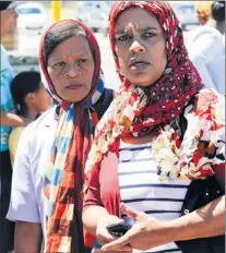  ?? PICTURE: LEON LESTRADE ?? APOLOGY: Adeebah Salie, right, and her mother Hilda Hartick leave the Mitchells Plain Magistrate’s Court, where Morne Manuel appeared on a charge of murdering their sister and daughter Janine Manuel.