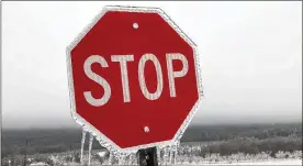 ?? HARTFORD COURANT ?? A stop sign is covered with ice in Middlefiel­d, Conn., after a storm there. Another storm system, which dumped over a foot of snow in North and South Dakota and Nebraska is expected to arrive in New England by Tuesday morning.