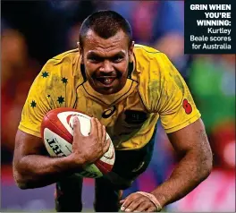  ??  ?? GRIN WHEN YOU’RE WINNING: Kurtley Beale scores for Australia