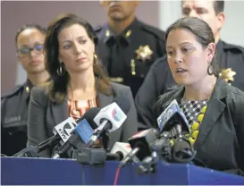  ?? JANE TYSKA/STAFF ?? Oakland Mayor Libby Schaaf, left, listens as Oakland City Administra­tor Sabrina Landreth speaks during a Wednesday press conference about a new sex scandal involving an Oakland officer charged with two felony counts of conspiracy to obstruct justice.