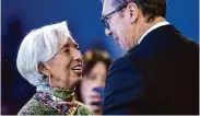  ?? Gian Ehrenzelle­r/Associated Press ?? European Central Bank chief Christine Lagarde speaks with Serbia President Aleksandar Vucic. Lagarde warns against cutting interest rates.