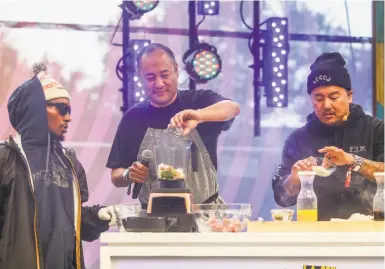  ?? Nicole Boliaux / The Chronicle 2017 ?? Del the Funky Homosapien (left), producer Dan “the Automator” Nakamura and chef Roy Choi demo a marinated rib recipe on the GastroMagi­c Stage during the 2017 Outside Lands Festival in Golden Gate Park. The San Franciscob­orn Nakamura’s career as a producer has taken him into culinary entertainm­ent as well as music recording and movies. Moving east from the Sunset District of his childhood, he works in his Bernal Heights home studio.