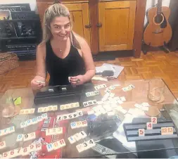  ?? JEN KIRSCH ?? After Jen Kirsch spent months during lockdown playing Rummikub with her dad, she introduced the game to her boyfriend and taught him the tricks of the trade.