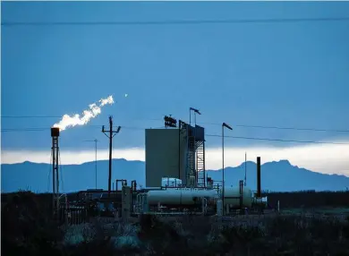  ?? Jon Shapley / Staff file photo ?? Natural gas is flared near Fort Stockton in 2019. Such emissions are one part of the total amount of gases released by processing plants, refineries, power plants and other facilities as they tried to cope during last month’s freeze in Texas.