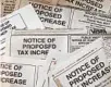  ?? BRITTANY WALLMAN ?? Legal notices warn property owners of pending tax increases.