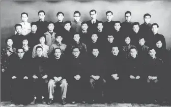  ?? ?? Jiang Zemin (front row, fifth from right) poses for a group photograph in March 1963 with members of a leading group of technician­s in charge of work on the design of small, three-phase, asynchrono­us motors.