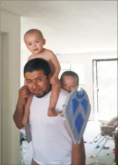  ??  ?? Bakhodir Madjitov with two of his sons in 2016.