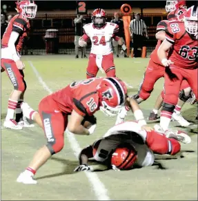  ?? MARK HUMPHREY ENTERPRISE-LEADER ?? Farmington senior tailback Caleb Williams maintains his balance while a Clarksvill­e defender falls at the 5-yard-line. Williams rushed for 1,010 yards on 195 carries as the workhorse in the run game this season.