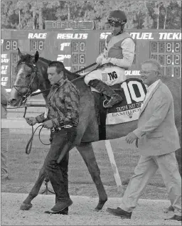  ?? TOM KEYSER ?? Trainer Bill Mott, right, says Tacitus, winner of the Tampa Bay Derby, will go next in either the Wood, Blue Grass, or Arkansas Derby.