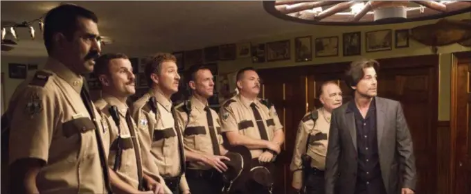  ??  ?? Jay Chandrasek­har, left, Steve Lemme, Paul Soter, Erik Stolhanske, Kevin Heffernan, Brian Cox and Rob Lowe appear in a scene from “Super Troopers 2.” FOX SEARCHLIGH­T