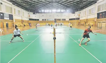  ?? — Bernama photo ?? File photo of national shuttlers training at Stadium Bukit Kiara in Kuala Lumpur.