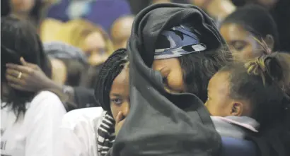  ?? Picture: Refilwe Modise ?? GRIEF. Friends and family members of murdered Karabo Mokoena during a memorial service at Diepkloof Hall in Soweto yesterday.