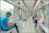  ?? DEEPAK GUPTA/HT ?? Jewellery and other shops opened in Mohan Market in Aminabad area of Lucknow and (right) passengers sitting while maintainin­g social distancing in a Metro coach as the UPMRC resumed its services after 40 days of Covid curfew, on Wednesday.