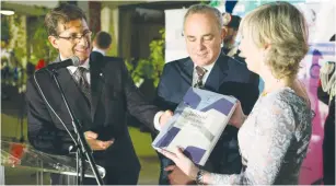  ??  ?? ITALIAN AMBASSADOR Francesco Talo (left) and Minister of Education, University and Research Stefania Giannini (right) present National Infrastruc­ture, Energy and Water Resources Minister Yuval Steinitz (center) with a copy of the first Italian...