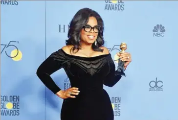  ?? FREDERIC J BROWN/AFP ?? Actress and TV talk show host Oprah Winfrey poses with the Cecil B DeMille Award during the 75th Golden Globe Awards on Sunday in Beverly Hills, California.