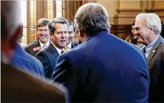  ?? BOB ANDRES / BANDRES@AJC.COM ?? Gov. Brian Kemp greets lawmakers during budget hearings Wednesday. A 2017 lawsuit said Kemp failed to repay a loan he guaranteed for Hart AgStrong, a Georgia seed processor.