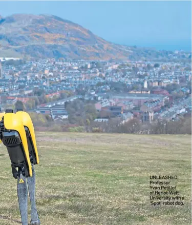  ??  ?? UNLEASHED: Professor Yvan Petillot of Heriot-Watt University with a ‘Spot’ robot dog.