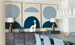  ?? SCOTT GABRIEL MORRIS/ TNS ?? Three pieces of art hung in a series help add rhythm to this dining room area.