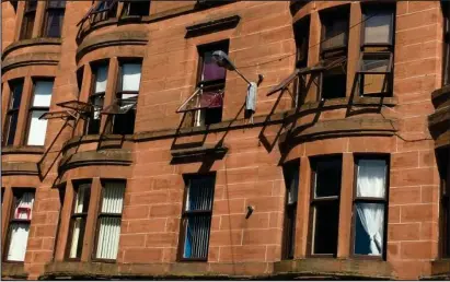  ??  ?? The fire struck the tenement building in Govan’s Elder Street on Saturday, and below, how we reported the blaze