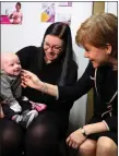  ??  ?? „ Nicola Sturgeon with Megan Mcbride and son Killian.