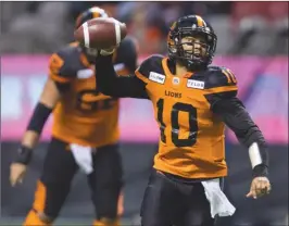  ??  ?? B.C. Lions quarterbac­k Jonathon Jennings (10) looks to pass while running with the ball during first-half CFL pre-season action against the Winnipeg Blue Bombers in Vancouver this past Friday.The Lions won 34-21 and were unbeaten in exhibition play.