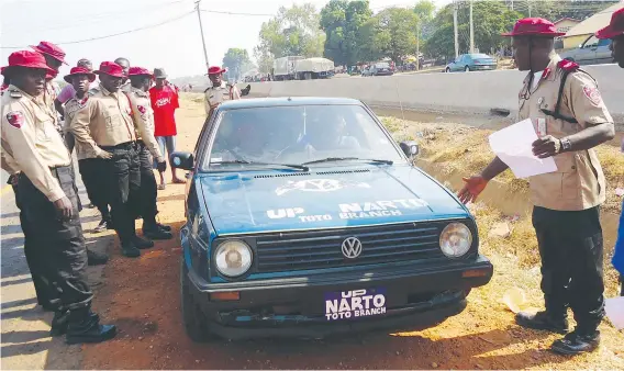  ??  ?? FRSC officials flagged down a commercial vehicle belonging to a transport union during a special road patrol for the just concluded yuletide on Abuja-Lokoja road.