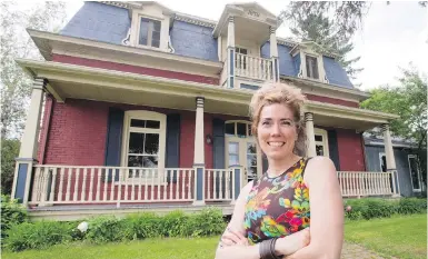  ??  ?? Nathalie Gagnon in front of her historic chalet in Saint-Félix-de-Kingsey, Quebec, which she rents out along with a 17-bedroom, eight-bathroom hotel, catering to families who want to vacation together.