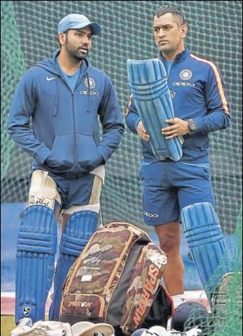  ?? PTI ?? India captain Rohit Sharma with MS Dhoni during a practice session on Tuesday.