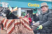  ?? (Pic: John Ahern) ?? MAN AND BEAST: An eye-catching spin on his tractor from Nicholas O’Leary and pet, in the Fermoy St. Patrick’s Day parade.