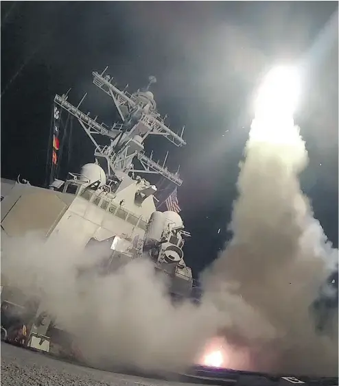  ?? FORD WILLIAMS / U. S. NAVY VIA GETTY IMAGES ?? The guided-missile destroyer USS Porter fires a Tomahawk land attack missile on Friday in the Mediterran­ean Sea.