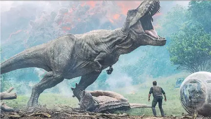  ?? UNIVERSAL ?? In the latest Jurassic Park story, starring Chris Pratt and Bryce Dallas Howard, the dinosaurs in Fallen Kingdom — again threatened with extinction — are pursued by poachers and others who wish to capture and capitalize on an endangered if dangerous...