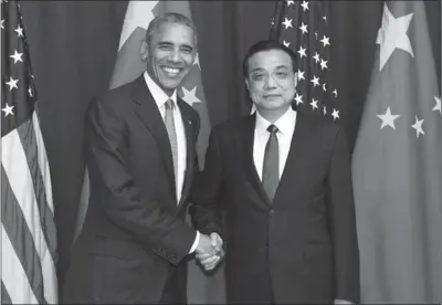  ?? LI XUEREN / XINHUA ?? President Obama meets with Premier Li Keqiang at the United Nations General Assembly on Monday in New York.