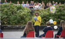  ??  ?? Principal of Caherleahe­en NS Mary Connolly addresses the sixthclass pupils at their graduation ceremony.