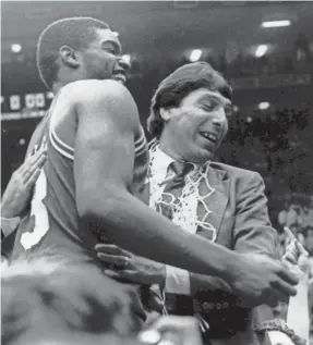  ?? MALCOLM EMMONS/USA TODAY SPORTS ?? North Carolina State coach Jim Valvano celebrated with Lorenzo Charles in 1983 after the Wolfpack won the national championsh­ip with a shocking 54-52 victory over Houston. Charles made the game-winning dunk.