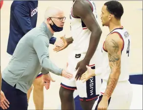  ?? David Butler II / USA Today ?? UConn coach Dan Hurley reacts as his players come off the court during a game against Hartford on Nov. 27. Hurley might have a “mask change” for Wednesday’s game against DePaul and said he’ll try it during the afternoon shootaroun­d to see whether it’s viable for the game.