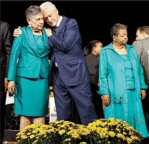  ?? Arkansas Democrat-Gazette/MITCHELL PE MASILUN ?? Former President Bill Clinton embraces Carlotta Walls LaNier, one of the Little Rock Nine, at the end of the commemorat­ion ceremony Monday on the 60th anniversar­y of desegregat­ion at Little Rock Central High School. Another Little Rock Nine member...