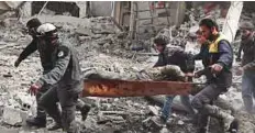  ?? AFP ?? Rescuers evacuate an injured civilian from an area hit by a regime air strike in Saqba, Eastern Ghouta.