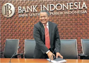  ??  ?? Bank Indonesia’s new governor, Perry Warjiyo, smiles after a media briefing at the central bank’s headquarte­rs in Jakarta yesterday.